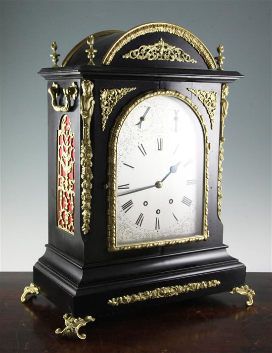 A Victorian style brass mounted ebonised chiming bracket clock, height 23.5in.